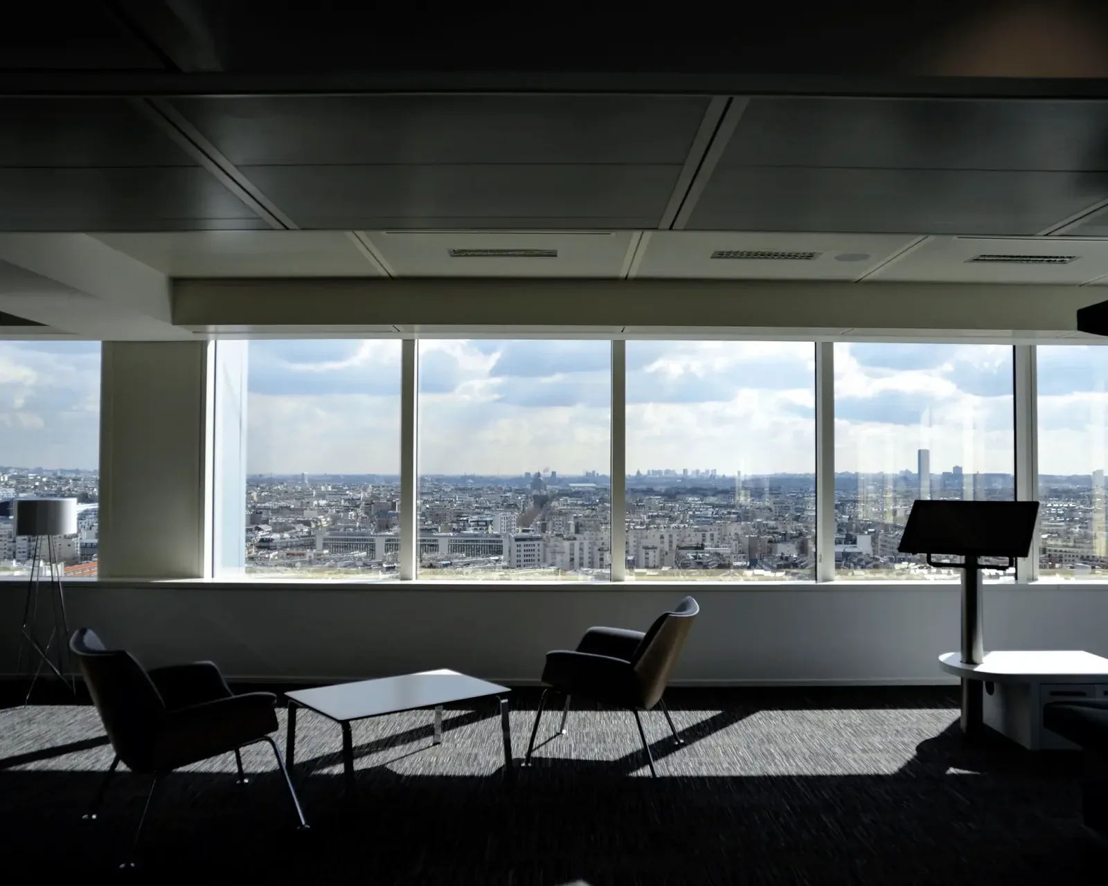 Empty commercial office overlooking a city skyline, representing the vacant property context of the beneficial occupation test